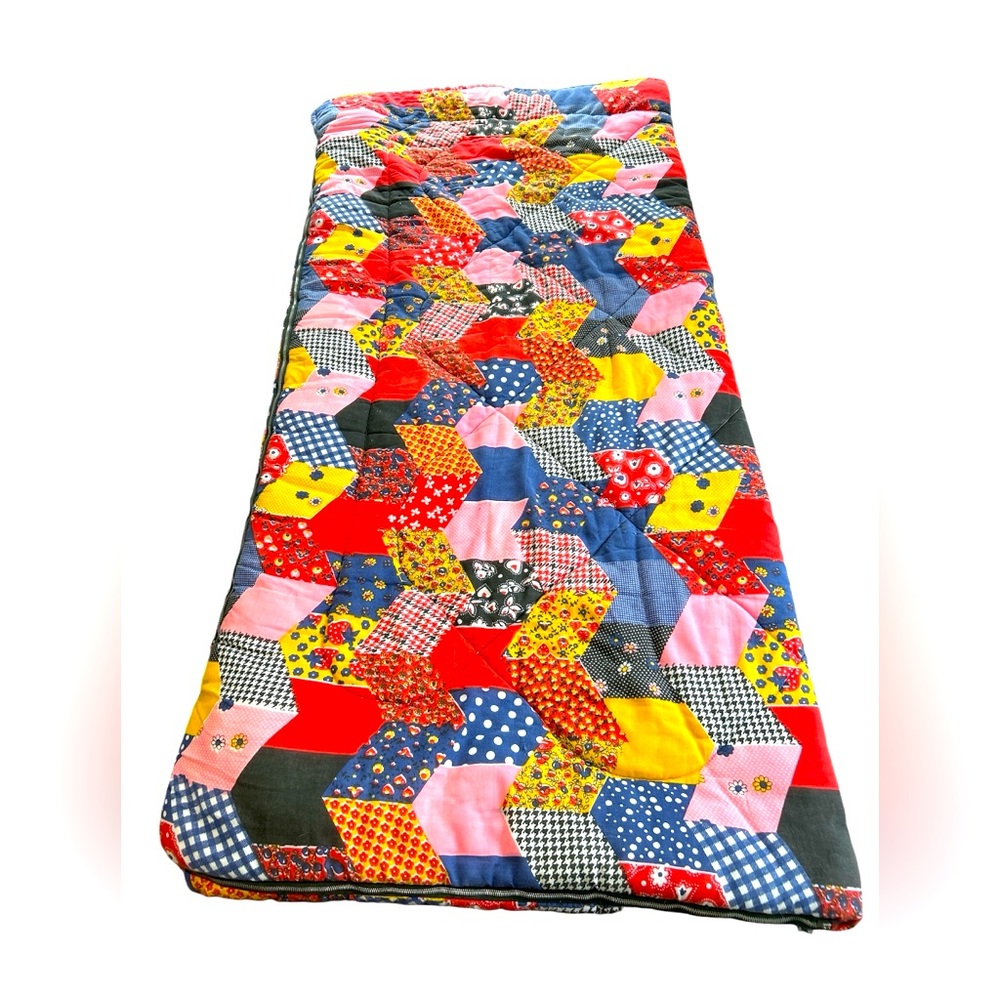 Vintage Coleman sleeping bag with patchwork type groovy design, metal zipper